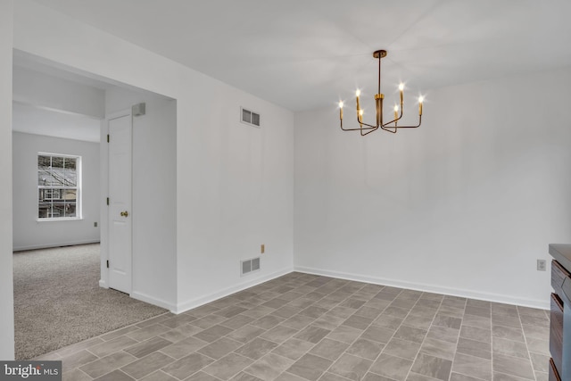 unfurnished dining area with visible vents, a notable chandelier, and baseboards