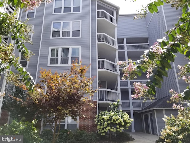 view of building exterior with driveway