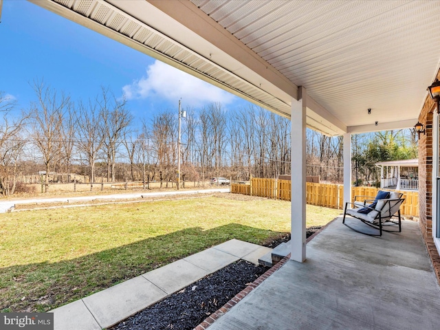 view of patio featuring fence