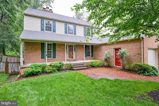 622 Hastings Rd, Baltimore, MD 21286 - view of front of home with covered porch, a chimney, a garage, and brick siding