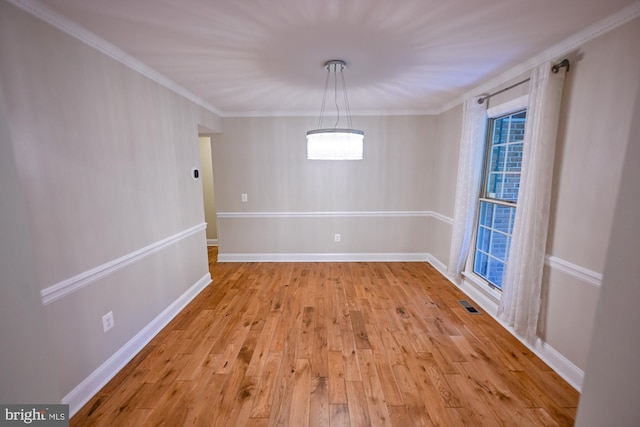 622 Hastings Rd, Baltimore, MD 21286 - unfurnished dining area with light wood-style floors and crown molding