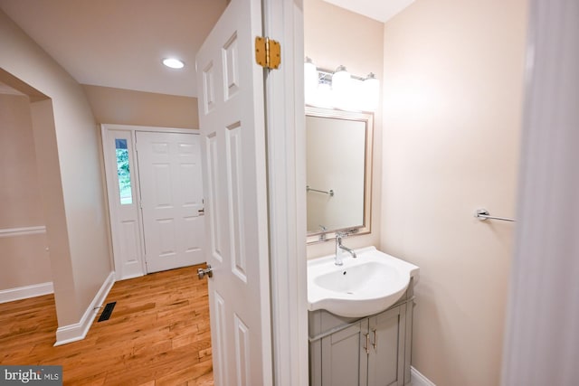 622 Hastings Rd, Baltimore, MD 21286 - bathroom featuring vanity, wood finished floors, and recessed lighting