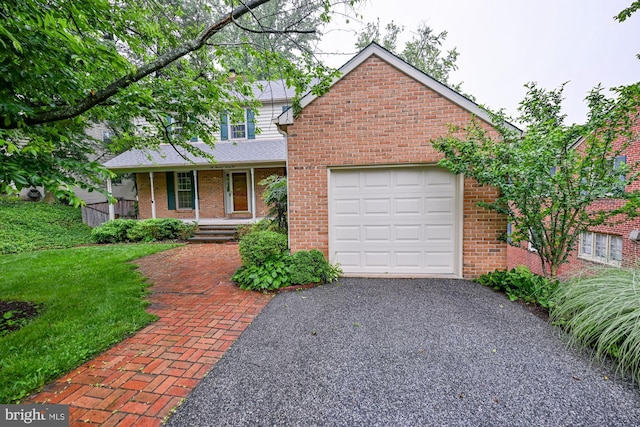622 Hastings Rd, Baltimore, MD 21286 - traditional-style house featuring covered porch, brick siding, driveway, and a garage