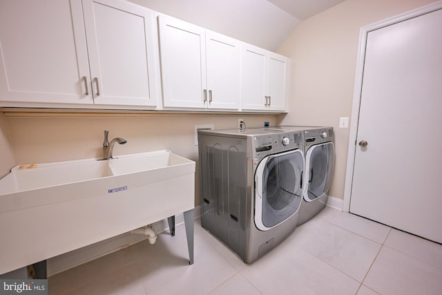 622 Hastings Rd, Baltimore, MD 21286 - laundry room with cabinet space, separate washer and dryer, and light tile patterned floors
