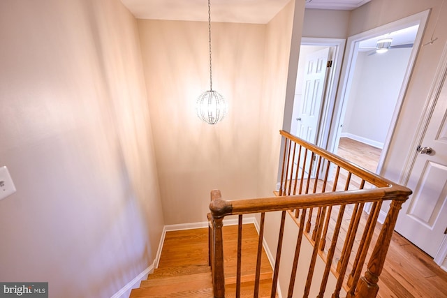 622 Hastings Rd, Baltimore, MD 21286 - staircase featuring wood finished floors and a chandelier