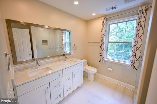 622 Hastings Rd, Baltimore, MD 21286 - full bathroom with double vanity, an enclosed shower, tile patterned floors, and recessed lighting