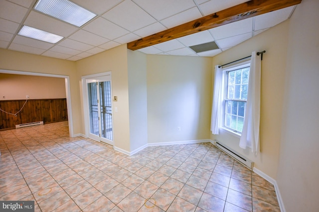 622 Hastings Rd, Baltimore, MD 21286 - unfurnished room with baseboard heating, a paneled ceiling, and light tile patterned flooring