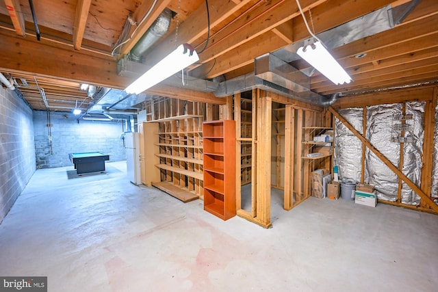 622 Hastings Rd, Baltimore, MD 21286 - unfinished basement featuring freestanding refrigerator and concrete block wall