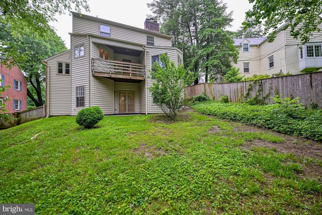 622 Hastings Rd, Baltimore, MD 21286 - rear view of property with a balcony, a fenced backyard, and a chimney