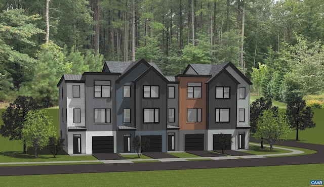 28A Keene Ct, Charlottesville, VA 22903 - townhome / multi-family property with a garage, a standing seam roof, a front yard, and a wooded view