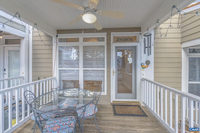 entrance to property with ceiling fan