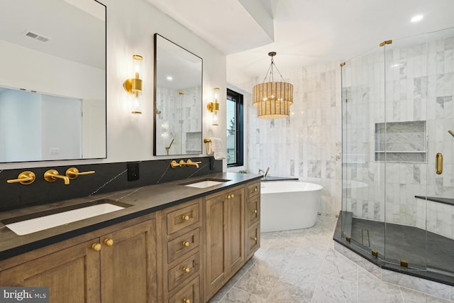 full bath featuring a freestanding bath, a stall shower, a sink, and visible vents