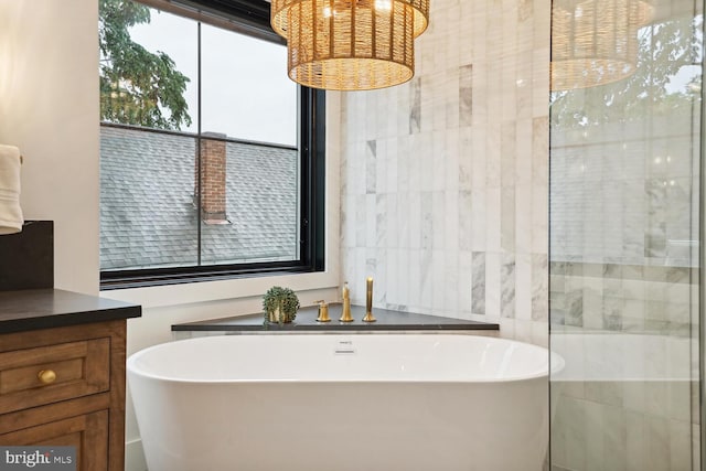 full bathroom featuring a soaking tub and tile walls