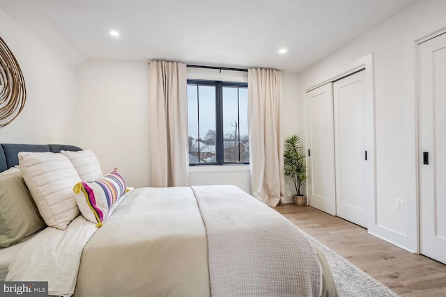 bedroom featuring wood finished floors and recessed lighting