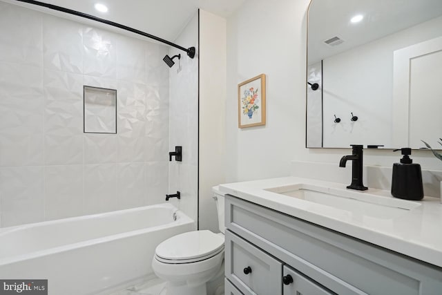 bathroom featuring marble finish floor, visible vents, toilet, tub / shower combination, and vanity