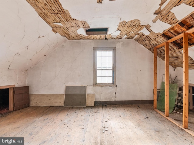 bonus room featuring wood-type flooring and lofted ceiling