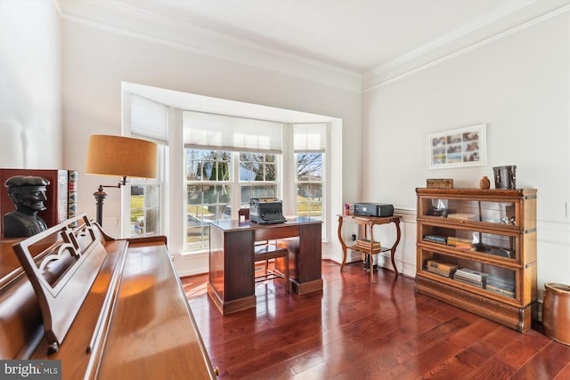 office with dark wood-type flooring, baseboards, and ornamental molding