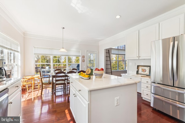 kitchen featuring stainless steel appliances, white cabinets, crown molding, light countertops, and dark wood-style flooring