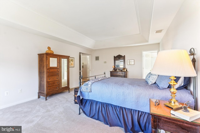 carpeted bedroom with baseboards, a raised ceiling, and visible vents