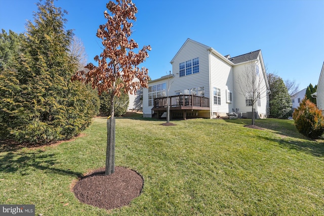 exterior space featuring a lawn and a deck