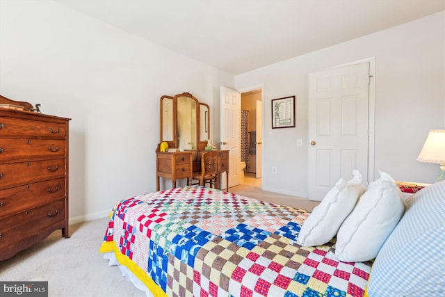 bedroom with baseboards and light colored carpet