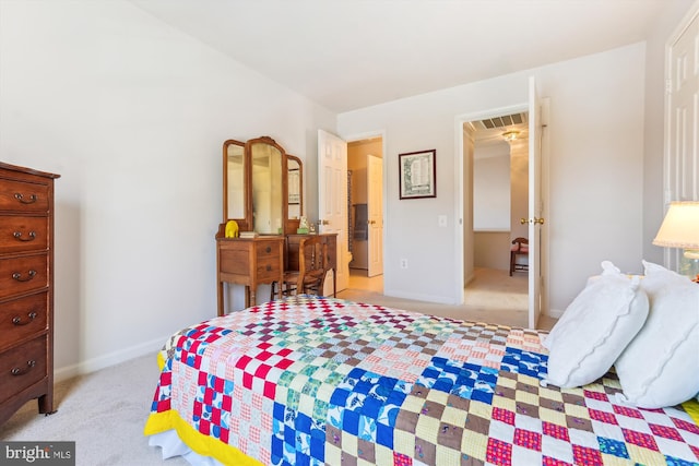 bedroom with visible vents, light colored carpet, and baseboards