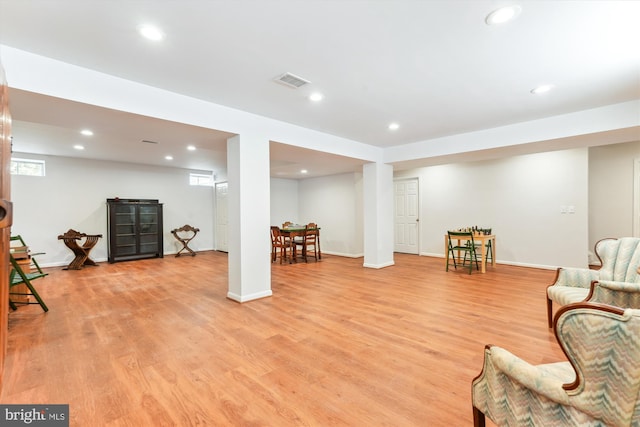 living area featuring recessed lighting, light wood-style floors, visible vents, and baseboards