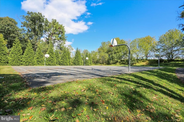 view of basketball court featuring community basketball court and a yard