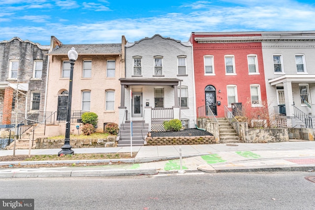 townhome / multi-family property with brick siding