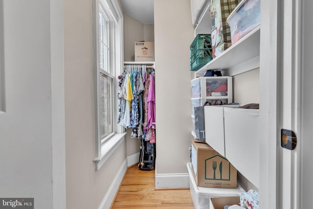 spacious closet featuring wood finished floors