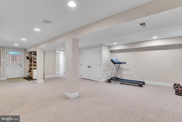 workout area featuring recessed lighting, carpet, and baseboards