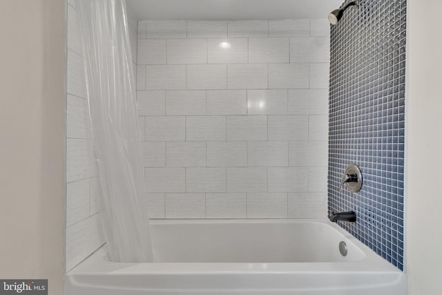 bathroom featuring shower / tub combo with curtain