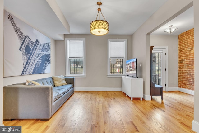 living area featuring wood finished floors and baseboards