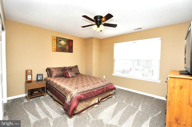 bedroom featuring baseboards, visible vents, ceiling fan, and carpet flooring