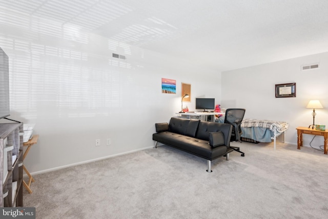 living room featuring baseboards, visible vents, and carpet flooring