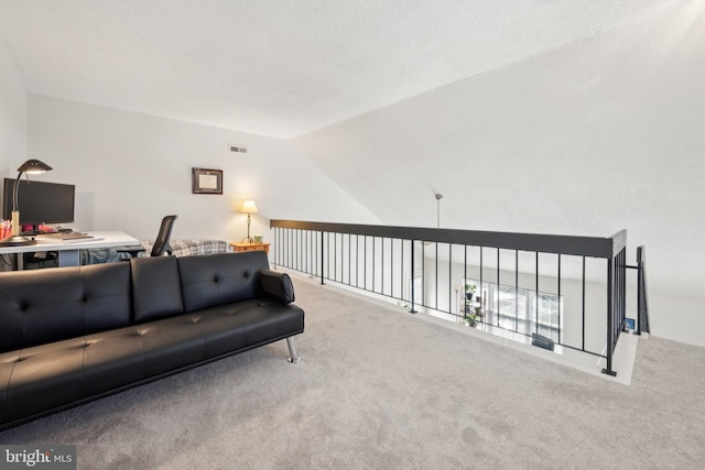 carpeted living area with lofted ceiling and visible vents