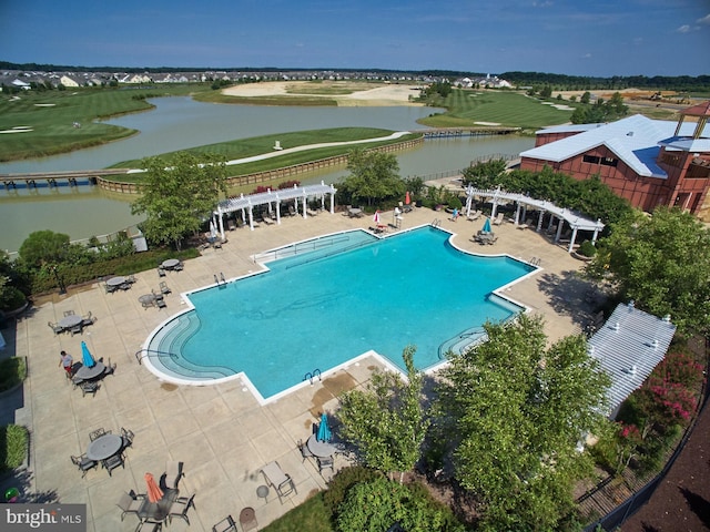 community pool with a patio area, golf course view, a water view, and a pergola