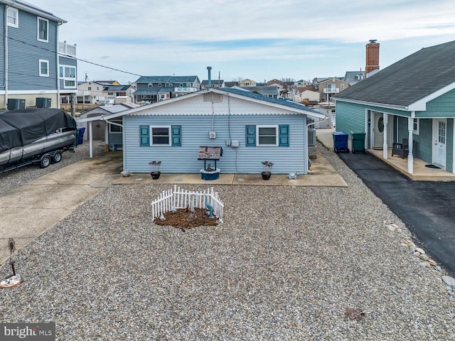 back of property with a residential view