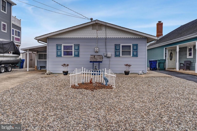 back of property featuring driveway