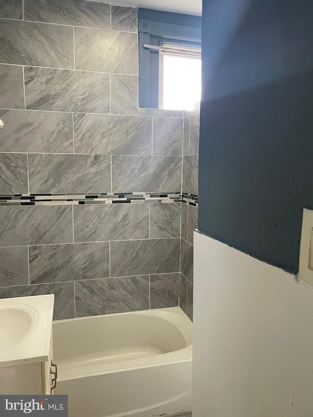 bathroom with shower / bathtub combination and vanity