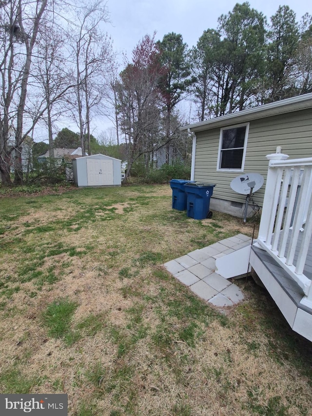 view of yard with an outbuilding and a storage shed