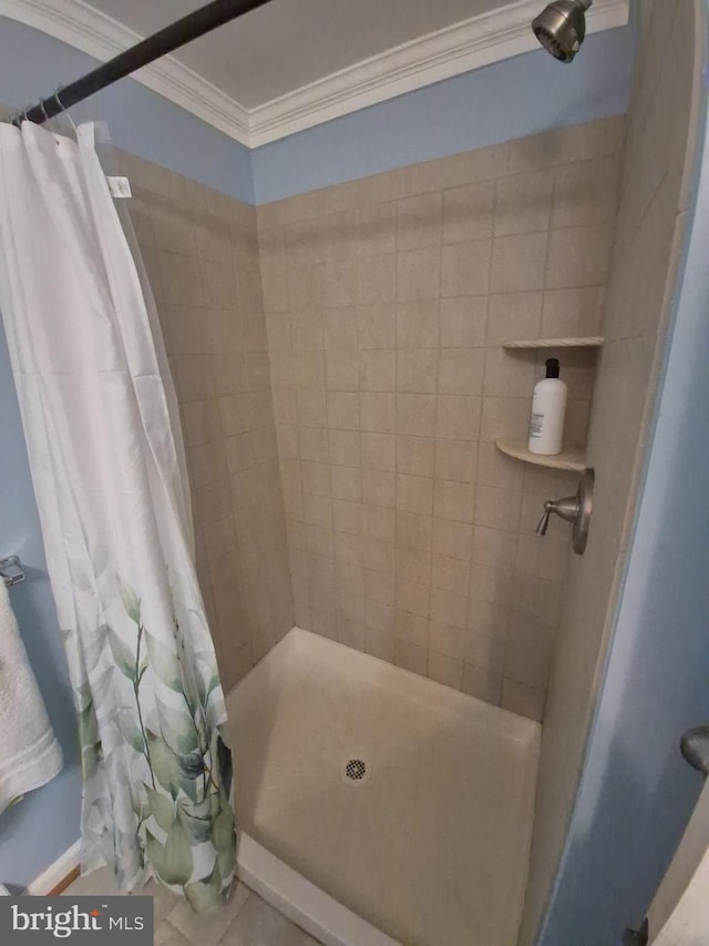 full bathroom with a shower stall and ornamental molding