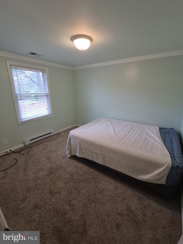 bedroom with a baseboard heating unit, ornamental molding, baseboards, carpet floors, and visible vents