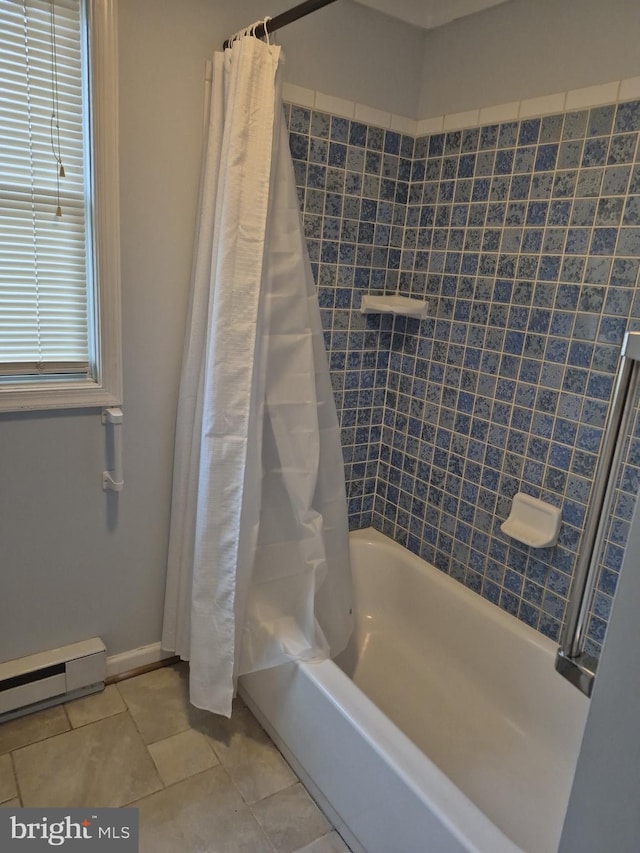 bathroom with tile patterned floors, shower / bath combo with shower curtain, baseboards, and a baseboard heating unit