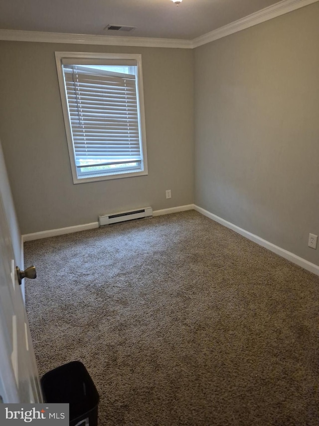 spare room featuring carpet flooring, visible vents, crown molding, baseboards, and baseboard heating