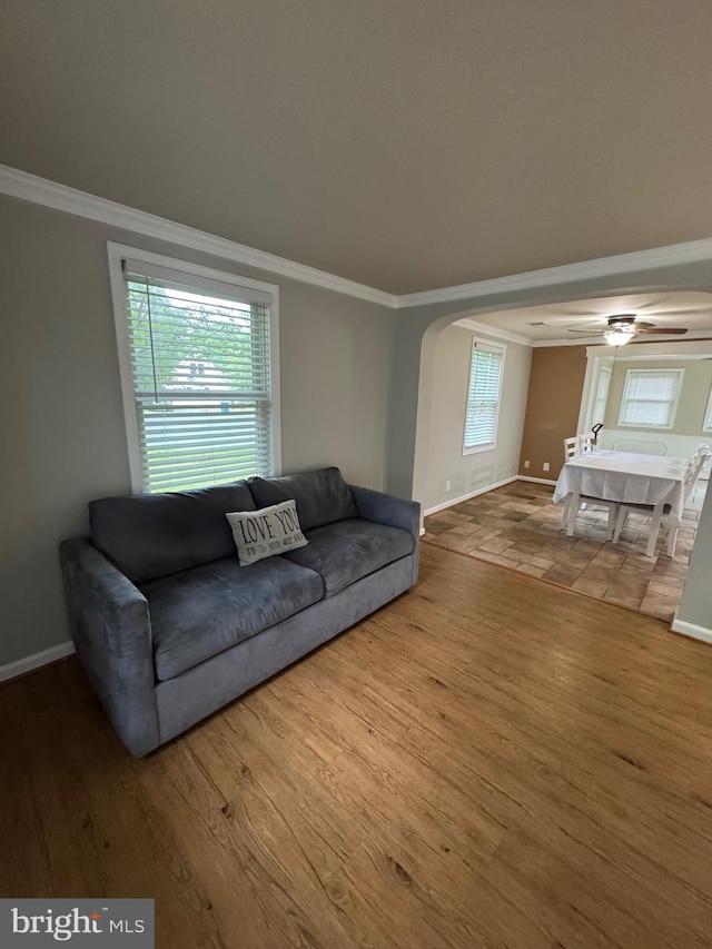 22 Alden Ct, Berlin, MD 21811 - living room featuring ornamental molding, baseboards, wood finished floors, and arched walkways