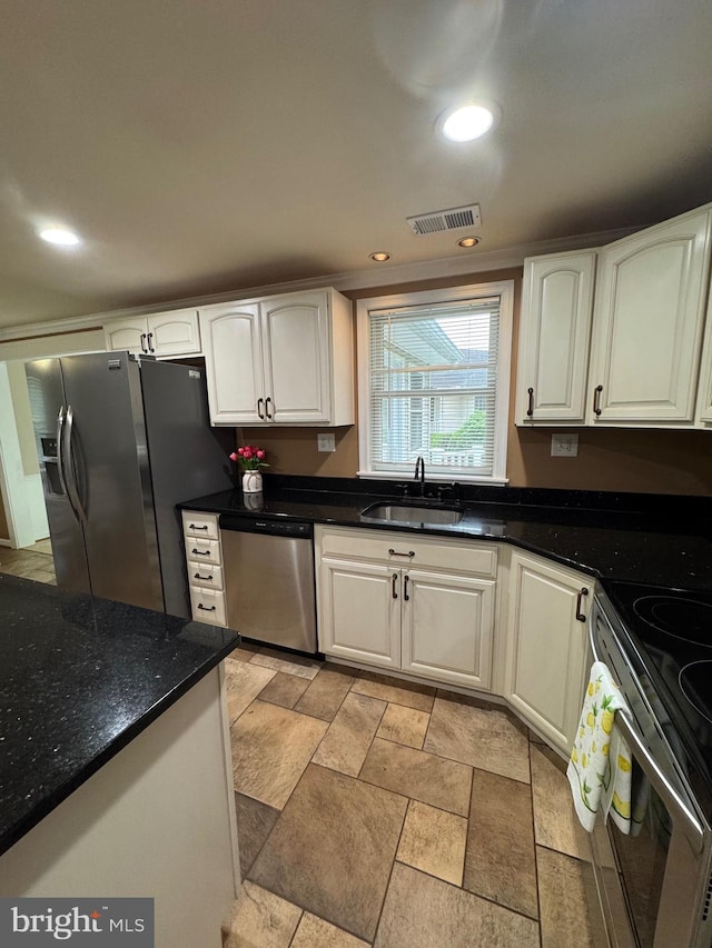 22 Alden Ct, Berlin, MD 21811 - kitchen with stainless steel appliances, a sink, white cabinetry, dark stone countertops, and recessed lighting