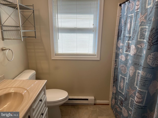 bathroom with a baseboard radiator, toilet, vanity, baseboards, and tile patterned floors