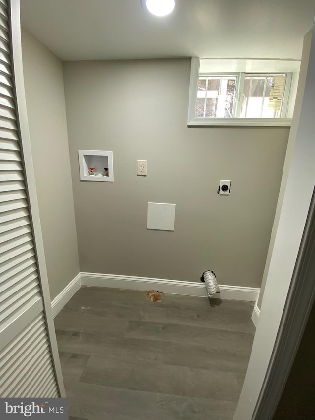 clothes washing area featuring wood finished floors, baseboards, hookup for an electric dryer, laundry area, and washer hookup