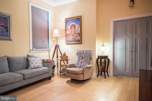 living room with baseboards and wood finished floors